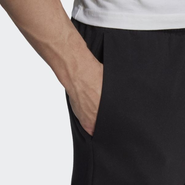 Pantalon Cargo Fuselé Regular En Molleton Essentials Noir Adidas