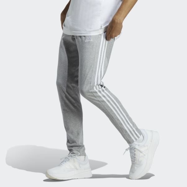 Pantalon Fuselé En Jersey Simple Essentiel à 3 Bandes Gris Moyen Adidas