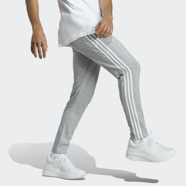 Pantalon Fuselé En Jersey Simple Essentiel à 3 Bandes Gris Moyen Adidas