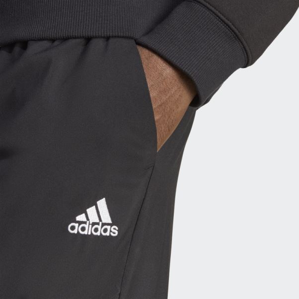 Pantalon Cargo Adidas Essentials Noir à Petit Logo Tissé à La Cheville
