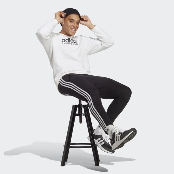 Essentials Pantalon Simple Jersey Fuselé Ourlet Ouvert 3 Bandes Adidas Noir