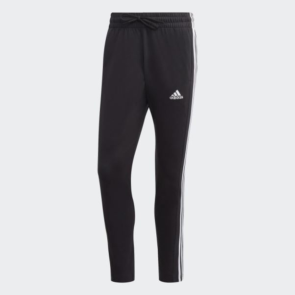 Essentials Pantalon Simple Jersey Fuselé Ourlet Ouvert 3 Bandes Adidas Noir