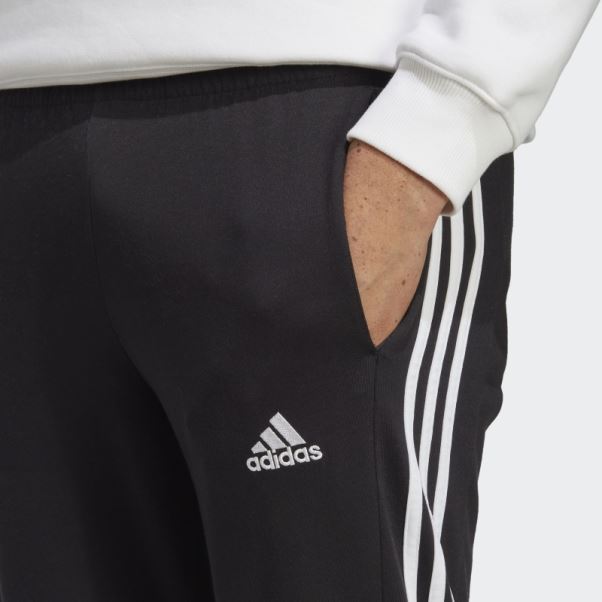 Essentials Pantalon Simple Jersey Fuselé Ourlet Ouvert 3 Bandes Adidas Noir